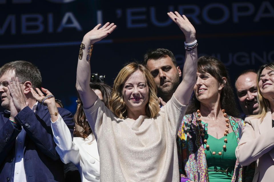 Italian Premier Giorgia Meloni, center, and Brothers of Italy fellow party members and candidates wave from the stage during an electoral rally ahead of the EU parliamentary elections that will take place in Italy on 8 and 9 June, in Rome, Saturday, June 1, 2024. (AP Photo/Alessandra Tarantino)