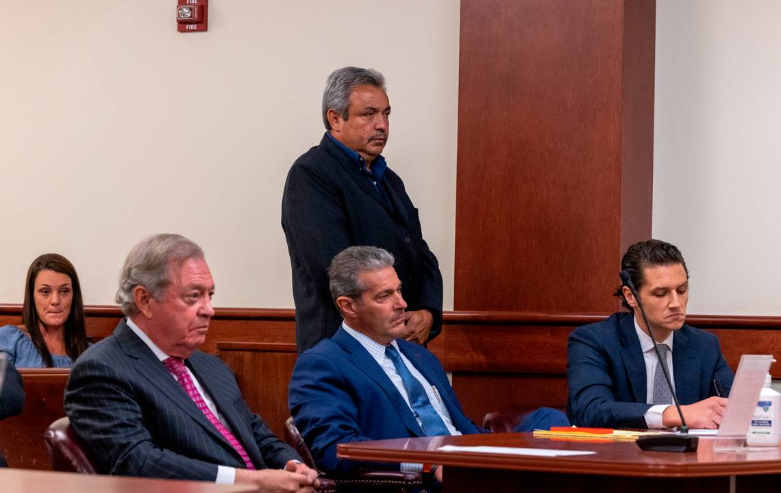 Greg Leon stands in court while be spoken to by Judge Debra R. McCaslin on Monday, July 18, 2022. His attorneys, Dick Harpootlian, Eric Bland and Chris Kenney are seated in front of him. Leon has been out on bond for more than six years while awaiting trial.