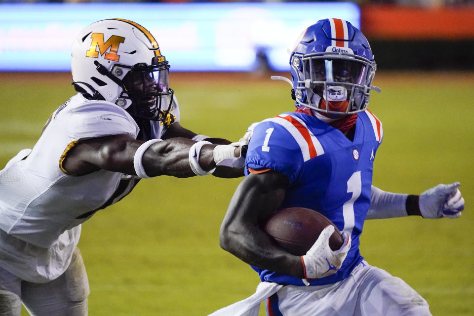 Florida wide receiver Kadarius Toney (1) runs for a 16-yard touchdown as he gets past Missouri linebacker Devin Nicholson during the second half of an NCAA college football game Saturday, Oct. 31, 2020, in Gainesville, Fla. (AP Photo/John Raoux)