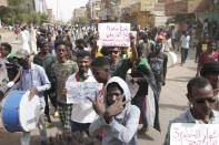 Anti-military protesters march on Friday, July 1, 2022 in Khartoum, Sudan, a day after nine people were killed in demonstrations against the country’s ruling generals. (AP Photo/Marwan Ali)