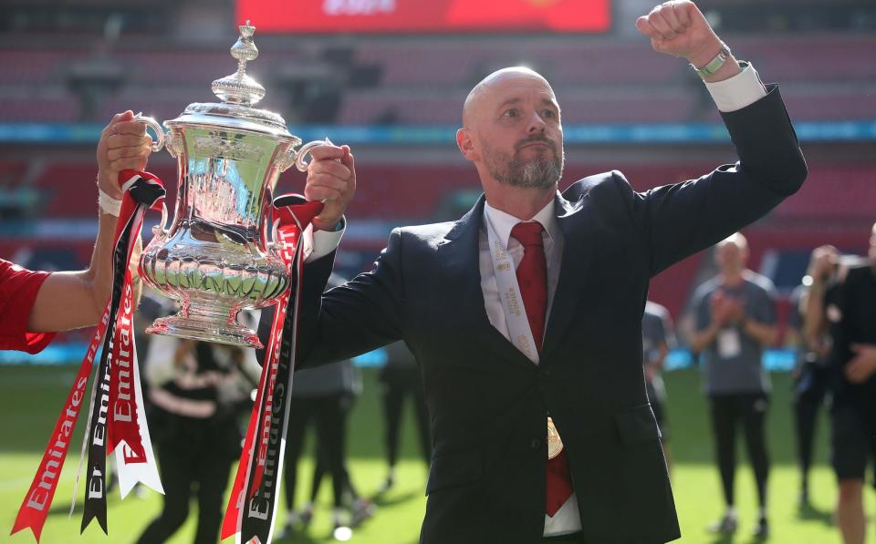 Erik ten Hag celebrates with the FA Cup trophy