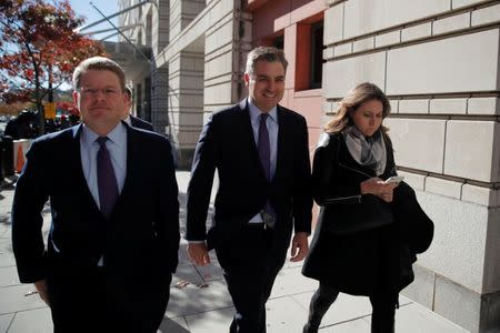 Cable News Network (CNN) Chief White House correspondent Jim Acosta departs with Washington Bureau Chief Sam Feist (L) and CNN-Washington Senior Director of Communications Lauren Pratapas after a judge temporarily restored Acosta's White House press credentials following a hearing at U.S. District Court in Washington, U.S., November 16, 2018. REUTERS/Carlos Barria