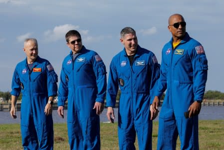 NASA commercial crew astronauts at Kennedy Space Center before SpaceX Crew Dragon spacecraft test flight