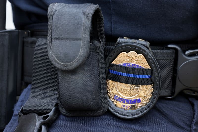 FILE PHOTO: A U.S. Capitol police officer's badge shows a black stripe in honor of deceased colleagues in Washington