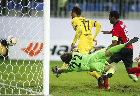 Borussia Dortmund's Pierre-Emerick Aubameyang (L, top) scores his third goal past Qabala's goalkeeper Dmytro Bezotosniy (L, bottom) during their Europa League group C soccer match at the Backcell Arena in Baku, Azerbaijan, October 22, 2015. REUTERS/David Mdzinarishvili