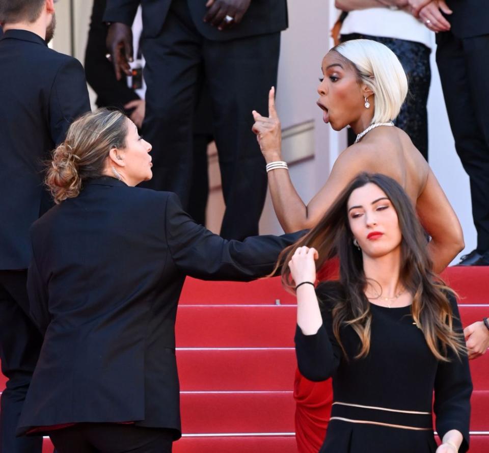 Rowland gets into it with a security guard at the Cannes Film Festival. David Fisher/Shutterstock