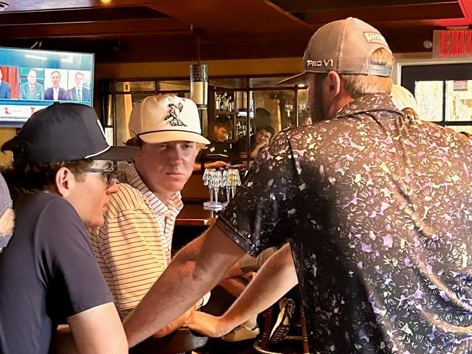 University of North Florida golfers (from the left) Chase Carroll, Andrew Riley and Davis Lee talks about their NCAA tournament prospects during a watch party on Wednesday at Cap's on the Water in Vilano Beach.