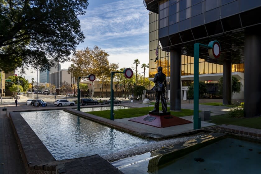 SAN BERNARDINO, CA - DECEMBER 17, 2020: A statue of Dr. Martin Luther King stands outside the San Bernardino City Hall on the day the County of San Bernardino filed a lawsuit with the California Supreme Court to stop the state's stay-at-home order amidst the coronavirus pandemic on December 17, 2020 in San Bernardino, California. The county is arguing in the lawsuit that Gov. Gavin Newsom lacks the legal authority over local closures.(Gina Ferazzi / Los Angeles Times)