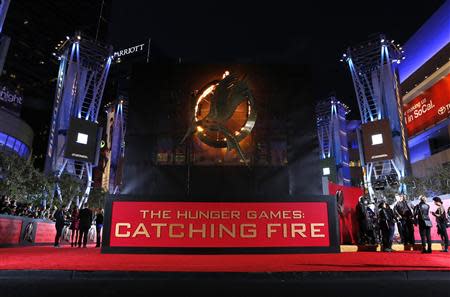 People wait at the premiere of "The Hunger Games: Catching Fire" in Los Angeles, California November 18, 2013. REUTERS/Mario Anzuoni