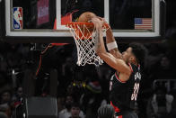 Portland Trail Blazers forward Toumani Camara (33) scores against the Atlanta Hawks during the first half of an NBA basketball game Wednesday, March 27, 2024, in Atlanta. (AP Photo/John Bazemore)