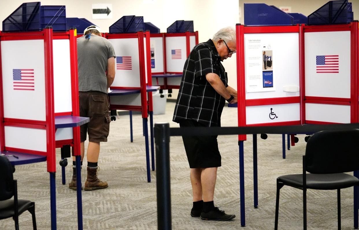Early voters at the Board of Elections in Norwood vote yes or no on Issue 1, the only thing on the ballot for the special election which will be Aug. 8. If passed, it would be harder to amend the state’s constitution. 