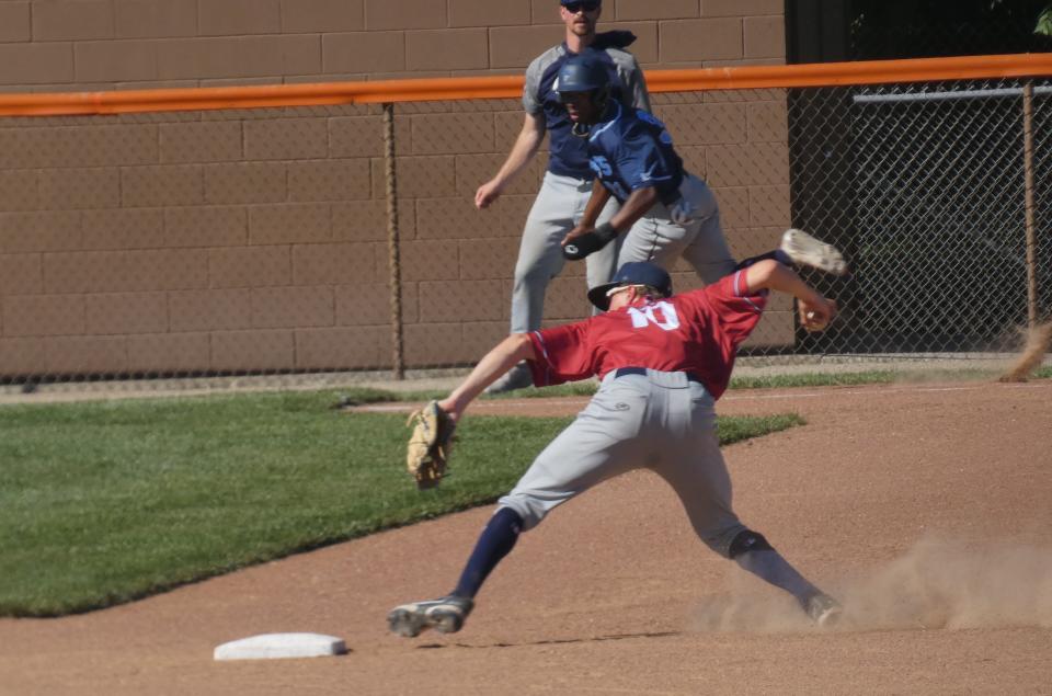 Licking County Settlers shortstop Nick Lukac sets to throw to first base while Xenia Scouts' Jeffery Heard rounds third base during Great Lakes Summer Collegiate League play at Heath's Dave Klontz Field on Friday, June 24, 2022. The Settlers fell to the visiting Scouts 9-1.