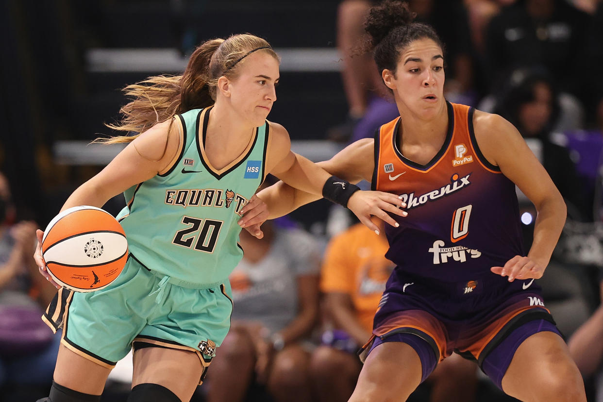 PHOENIX, ARIZONA - SEPTEMBER 23: Sabrina Ionescu #20 of the New York Liberty controls the ball against Kia Nurse #0 of the Phoenix Mercury during the second half of the first round WNBA playoffs at Grand Canyon University Arena on September 23, 2021 in Phoenix, Arizona.  The Mercury defeated the Liberty 83-82. (Photo by Christian Petersen/Getty Images)
