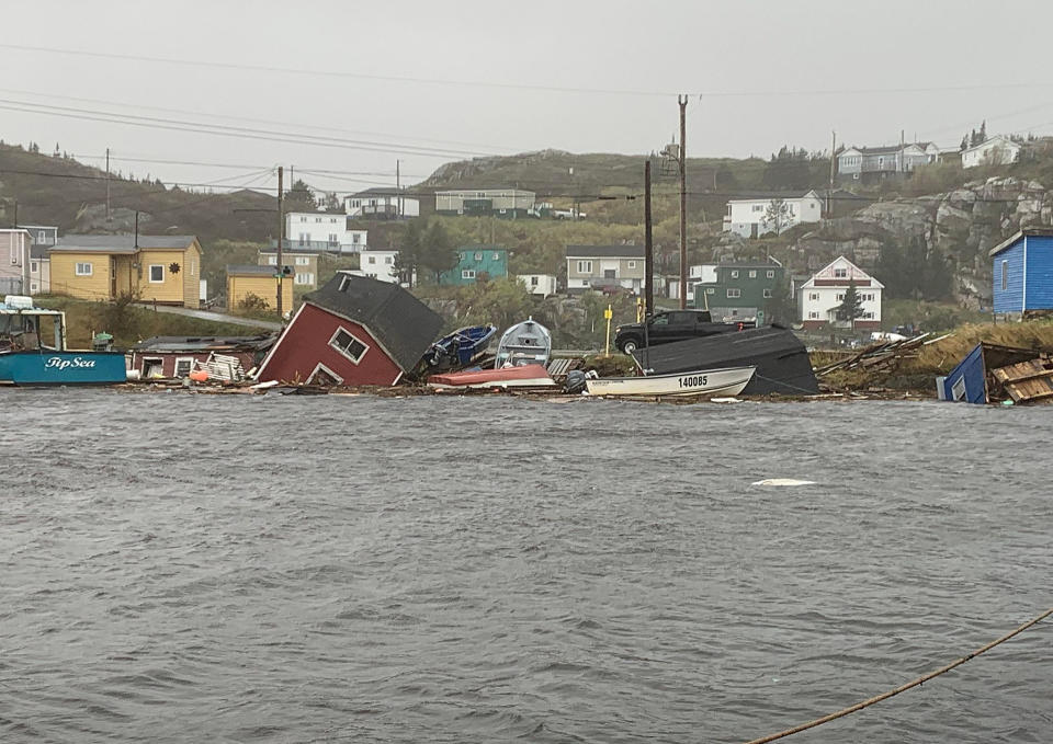 This photo provided by Pauline Billard shows destruction caused by Hurricane Fiona in Rose Blanche, 45 kilometers (28 miles) east of Port aux Basques, Newfoundland and Labrador, Saturday, Sept. 24, 2022. (Pauline Billard via AP)