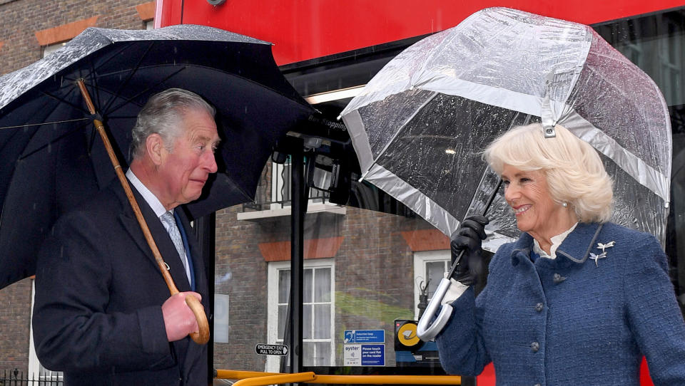 Britain's Prince Charles, Prince of Wales (L) and Britain's Camilla, Duchess of Cornwall prepare to board a new electric double decker bus at Clarence House, before travelling towards the London Transport Museum to take part in celebrations to mark 20 years of Transport for London (TfL) on March 4, 2020, in London. - TfL was set-up in 2000 to bring Londons transport network together under one integrated body. (Photo by Stuart C. Wilson / POOL / AFP) (Photo by STUART C. WILSON/POOL/AFP via Getty Images)