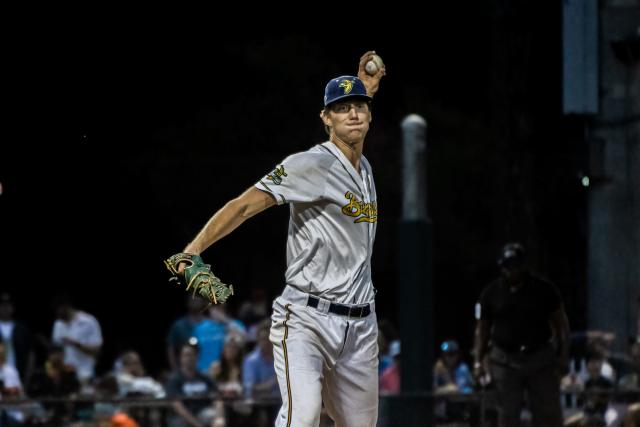 Savannah Bananas left-handed pitcher Jared Beck throws to first base to try to pick off a Morehead City runner during the 2021 season when the Bananas beat the Marlins for the Coastal Plain League championship.