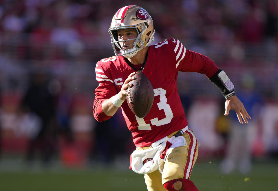 SANTA CLARA, CALIFORNIA - OCTOBER 29: Brock Purdy #13 of the San Francisco 49ers scrambles with the ball for a first down against the Cincinnati Bengals during the third quarter of an NFL football game at Levi's Stadium on October 29, 2023 in Santa Clara, California. (Photo by Thearon W. Henderson/Getty Images)