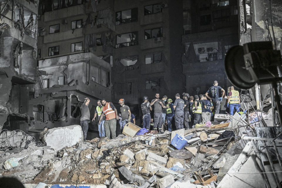 BEIRUT, LEBANON - OCTOBER 10: Lebanese civil defense and emergency teams conduct a search and rescue operation following the Israeli airstrike on the Nowayri area of Beirut, the capital of Lebanon on October 10, 2024. A building targeted in the attack was destroyed, and surrounding houses and vehicles got damaged. (Photo by Murat Sengul/Anadolu via Getty Images)