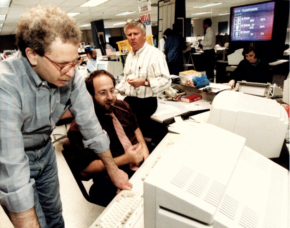 Associated Press journalists David Espo, bureau chief Jonathan Wolman and Walter Mears work on Election Day, November 1992, in Washington. (AP Photo)