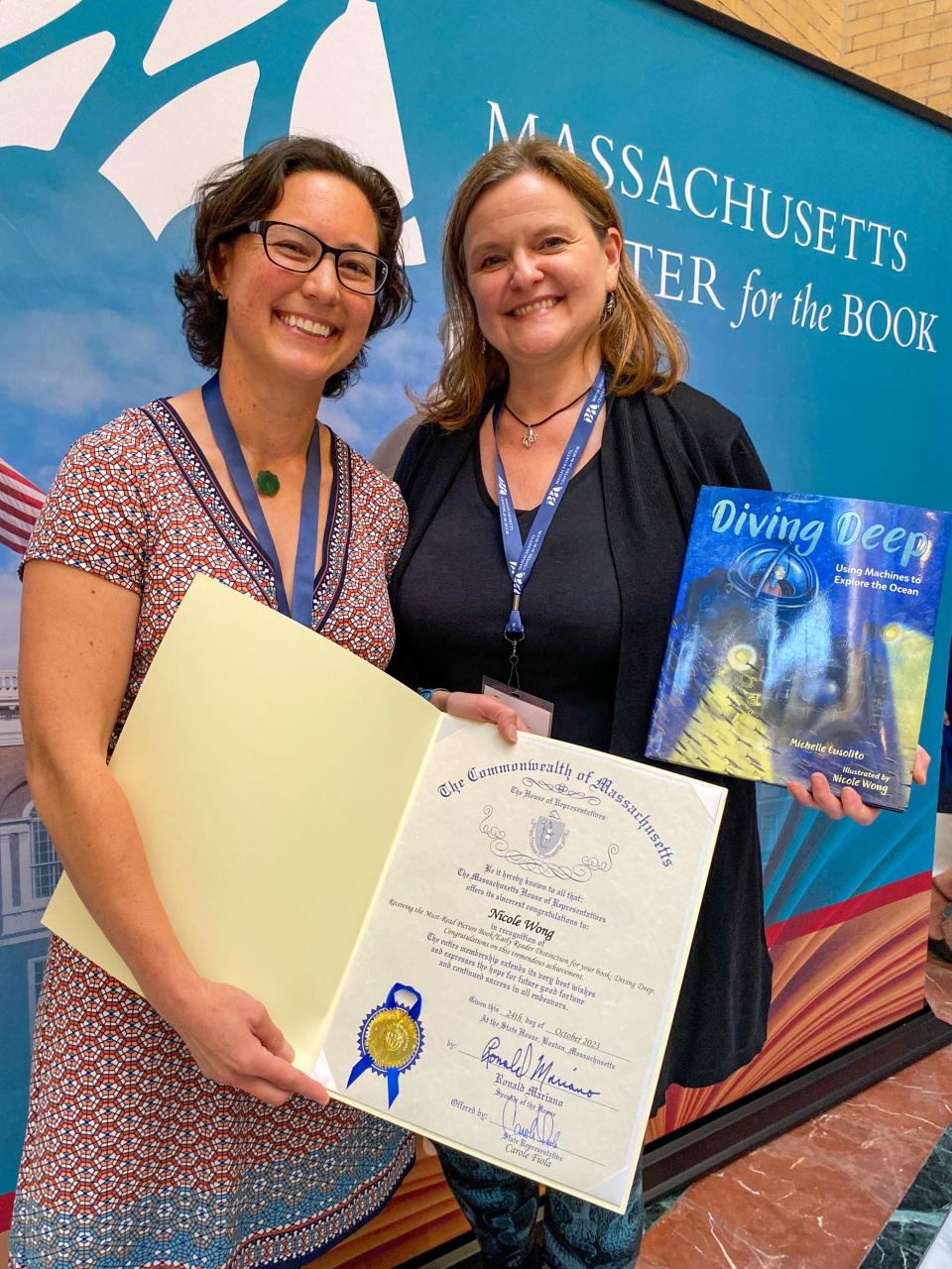 Illustrator Nicole Wong and author Michelle Cusolito with their award-winning book, Diving Deep, and a House citation given to Wong by Representative Carole Fiola.