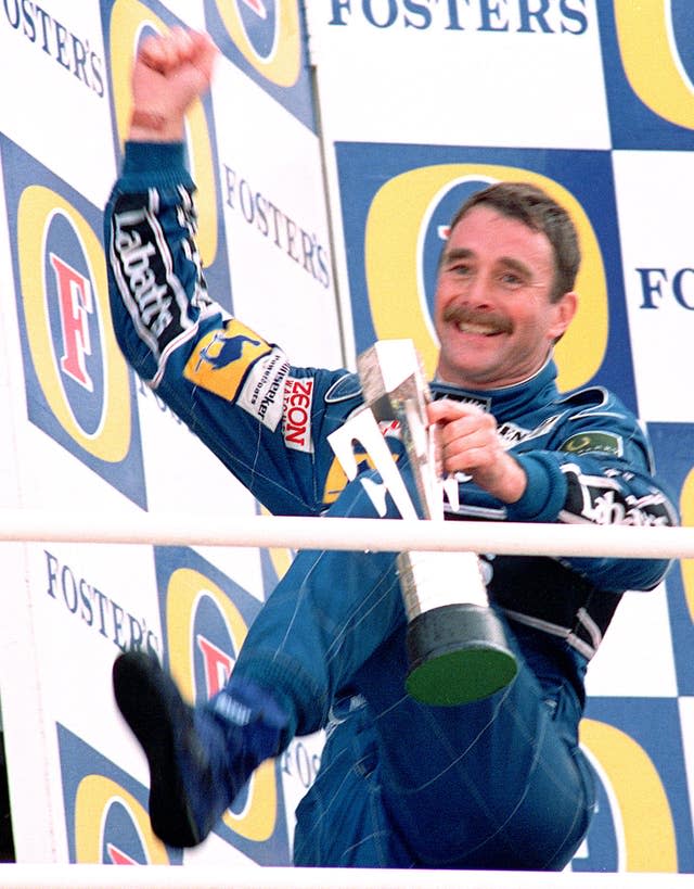 Nigel Mansell celebrates winning the 1992 British Grand Prix