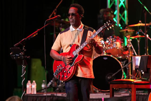 <p>Travis Ellison</p> Shawn Stockman of Boyz II Men and the Brown Noize Experience performs on stage with a guitar in hand.