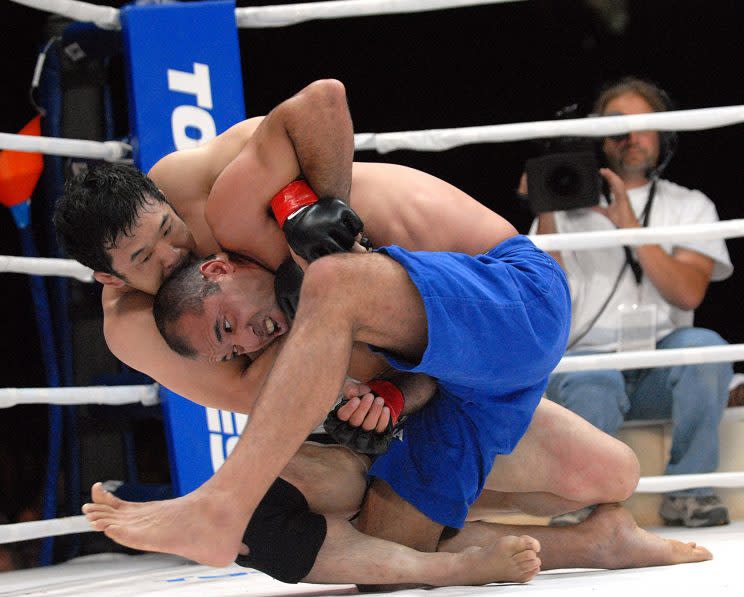 Kazushi Sakuraba (top), battling long-time rival Royce Gracie, was elected to the UFC Hall of Fame on Saturday. (Getty Images)