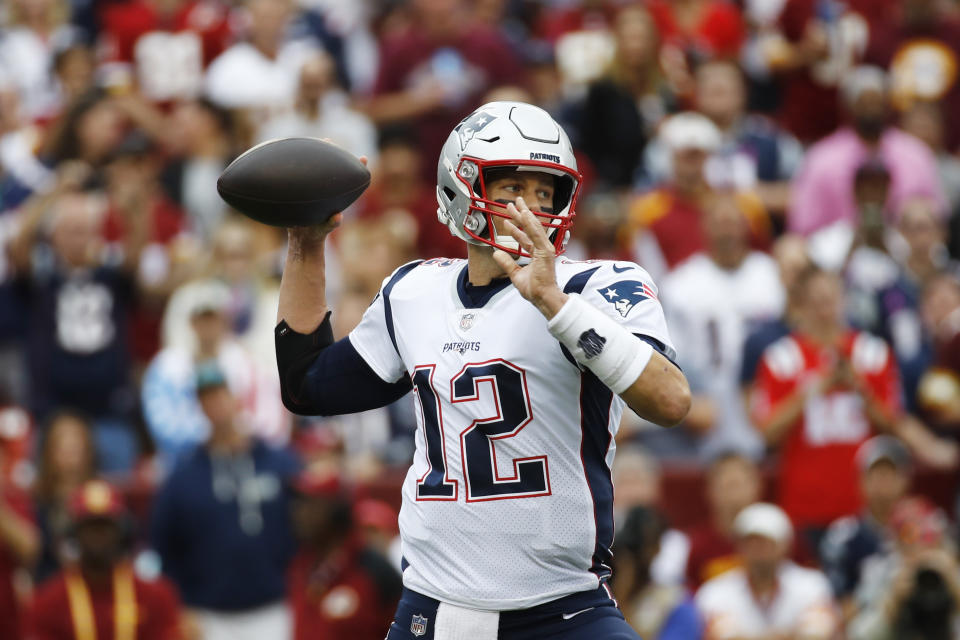 New England Patriots quarterback Tom Brady (12) works in ther pocket against the Washington Redskins during the first half of an NFL football game, Sunday, Oct. 6, 2019, in Washington. (AP Photo/Patrick Semansky)