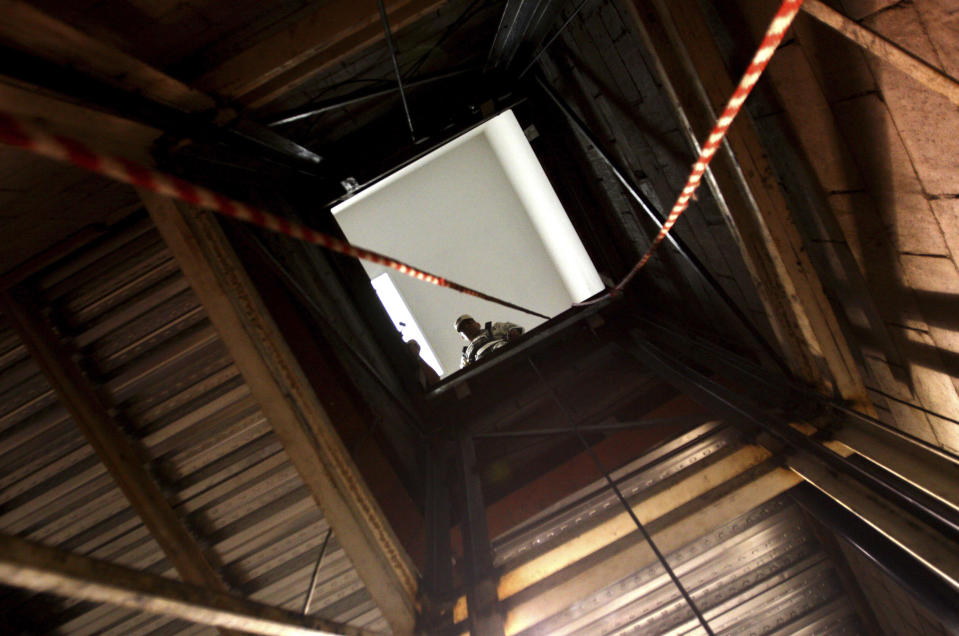 A soldier looks down into a tunnel found under the Mexico-U.S. border in Tijuana November 30, 2011. REUTERS/Jorge Duenes