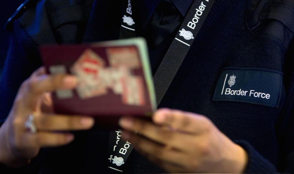File photo dated 04/06/14 of a Border Force officer checking passports. An Australian style-points-based immigration system should be introduced into the UK by the end of the year, the Home Secretary will reportedly tell Cabinet. PA Photo. Issue date: Monday January 20, 2020. Priti Patel will tell colleagues that Britain needs to speed up the introduction of the new migration system to coincide with the UK's planned transition out of EU regulations on December 31, the Daily Express reports. See PA story POLITICS Migration. Photo credit should read: Steve Parsons/PA Wire