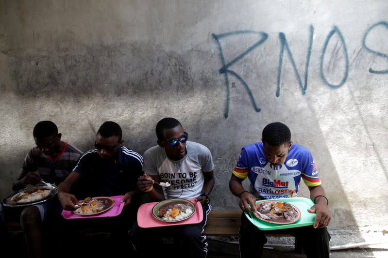 The Wider Image: Haiti's cyclists brave protests and poor roads in race for gold