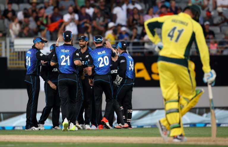 New Zealand's players celebrate the wicket of Australia's Kane Richardson during their first ODI match, at Eden Park in Auckland, on February 3, 2016