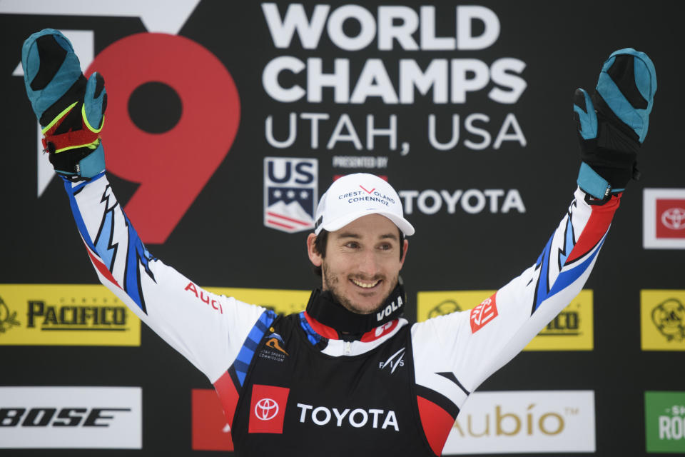 Gold medalist Francois Place, of France, celebrates on the podium after the men's ski cross event at the freestyle ski and snowboard world championships Saturday, Feb. 2, 2019, in Solitude, Utah. (AP Photo/Alex Goodlett)