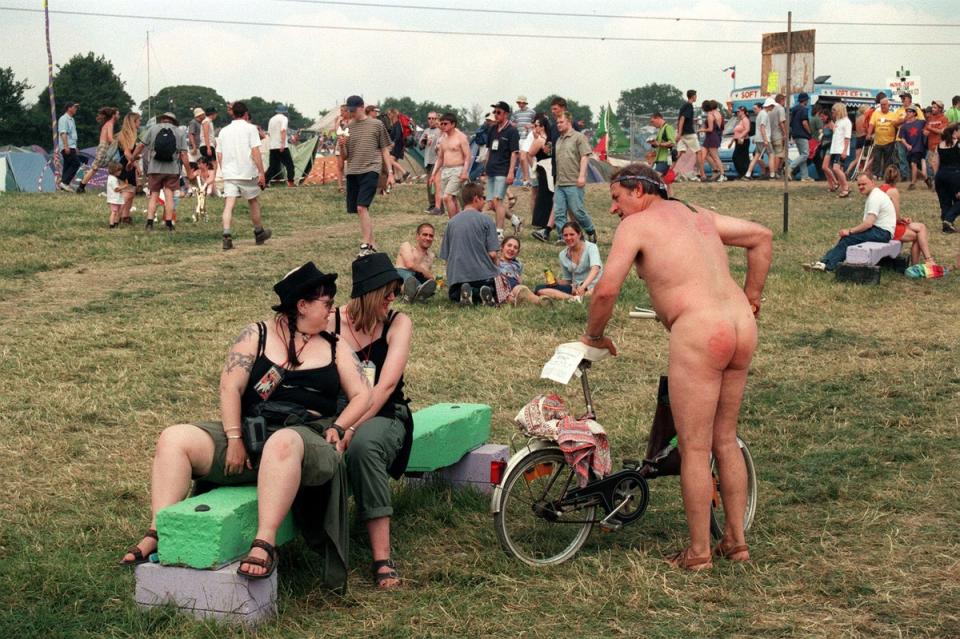 A naked festival goer in 1999 (PA)