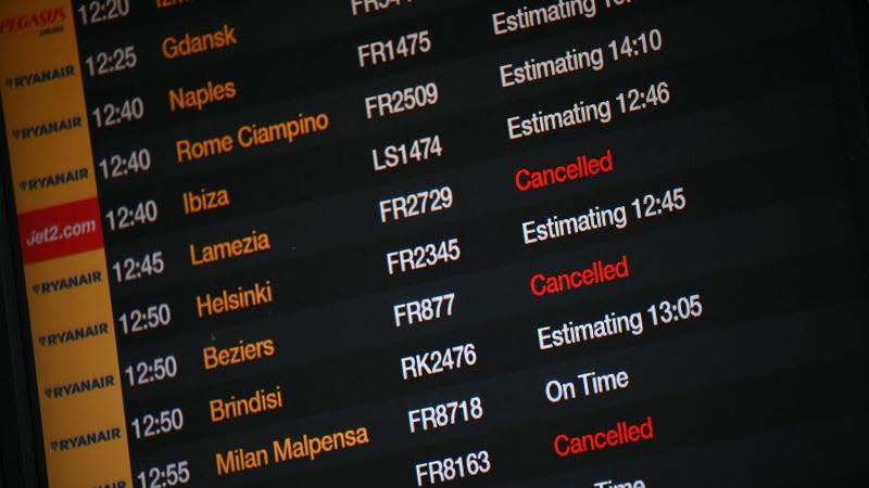 A photo of an airport departure board with canceled flights showing. 