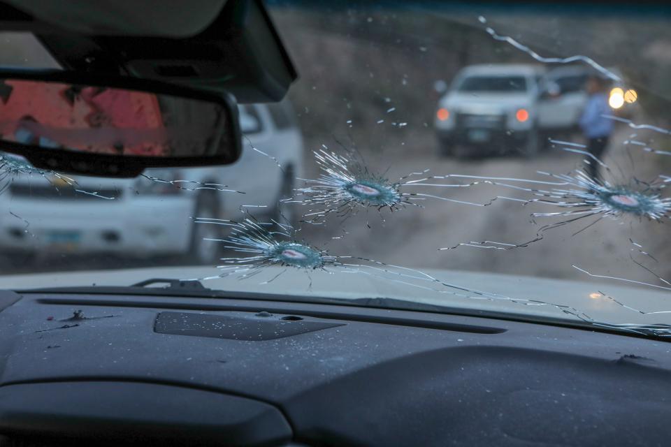 Bullet holes are seen in a car which was shot at by Mexican drug cartel.