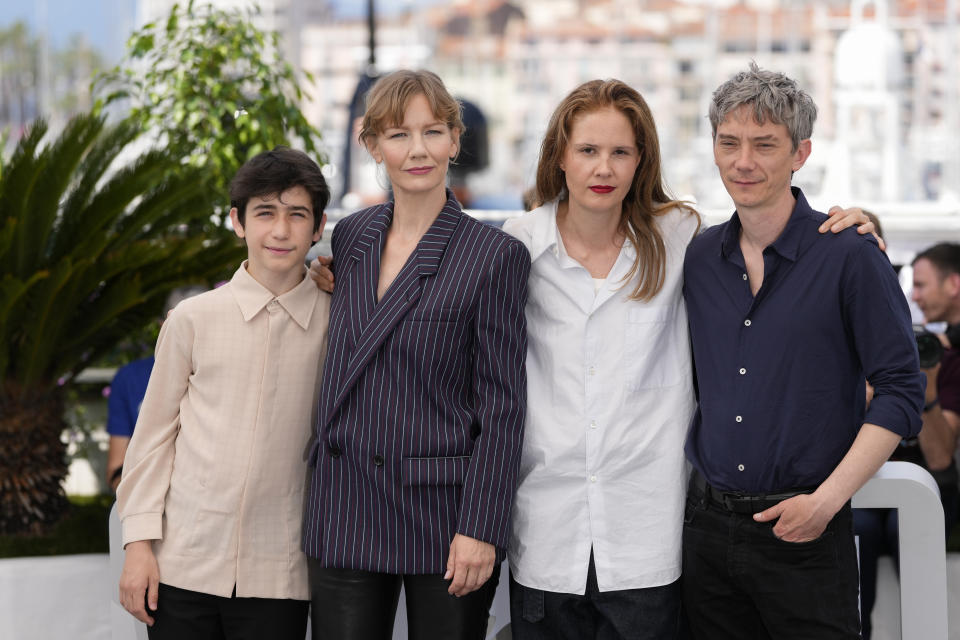 FILE - Milo Machado Graner, from left, Sandra Huller, director Justine Triet, and Swann Arlaud pose for photographers at the photo call for "Anatomy of a Fall" at the 76th international film festival, Cannes, southern France on May 22, 2023. (Photo by Scott Garfitt/Invision/AP, File)