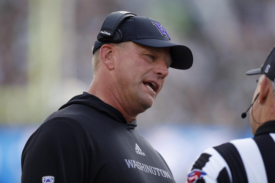 Washington coach Kalen DeBoer talks to an official during the first half of an NCAA college football game against Michigan State, Saturday, Sept. 16, 2023, in East Lansing, Mich. (AP Photo/Al Goldis)