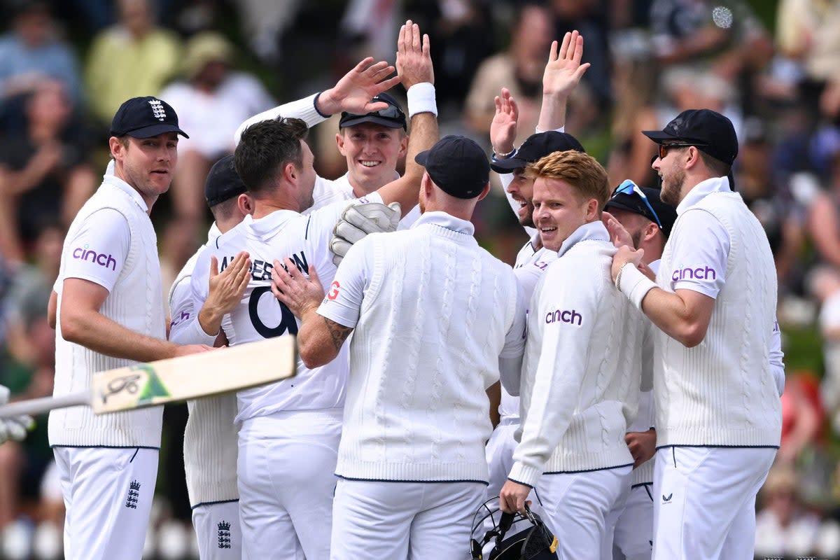 England players celebrate James Anderson’s first wicket (Andrew Cornaga/AP) (AP)