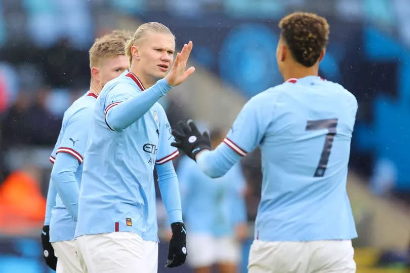 Morgan Rogers celebrates with Man City's Erling Haaland and Kevin De Bruyne