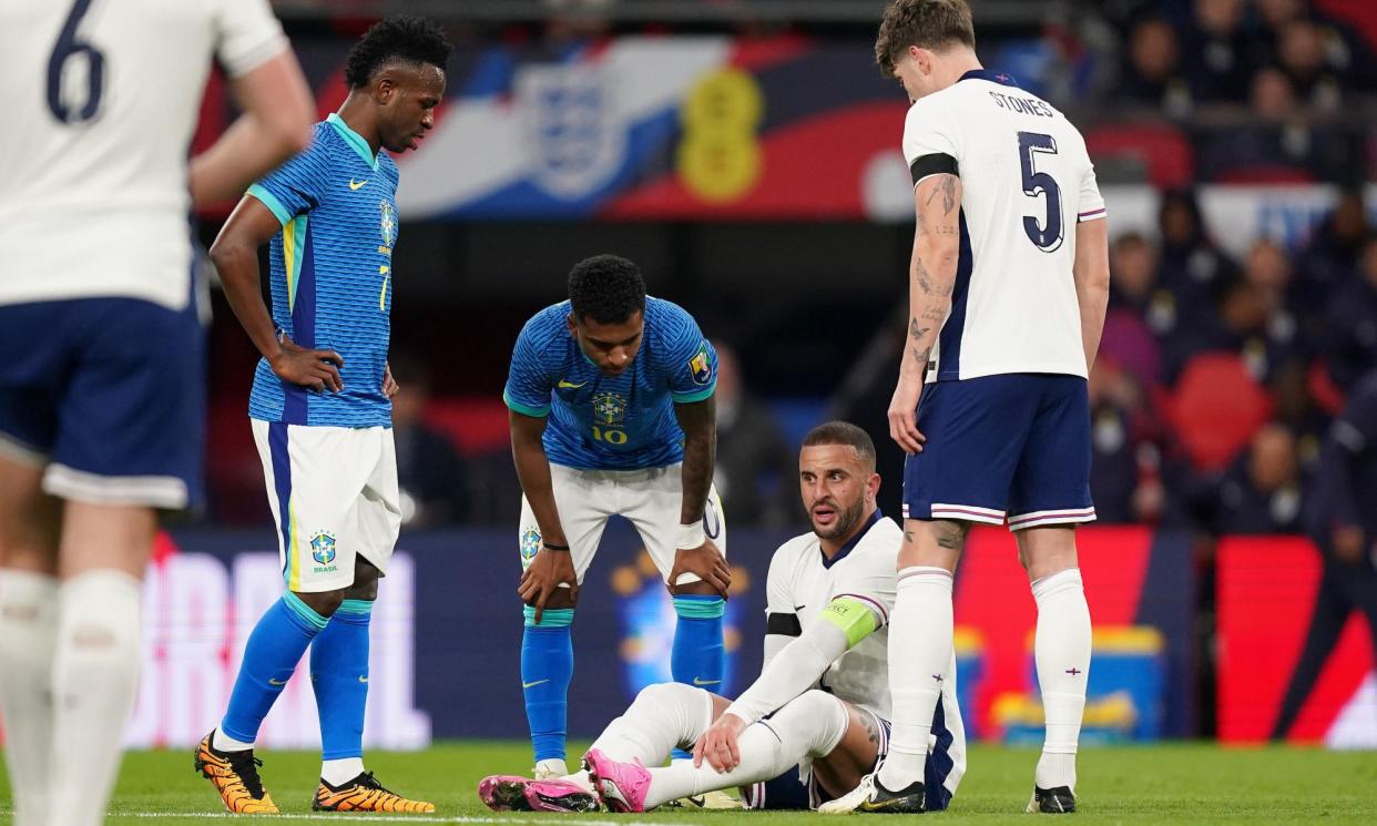 <span>Kyle Walker goes down injured during England’s 1-0 defeat to Brazil.</span><span>Photograph: Mike Egerton/PA</span>