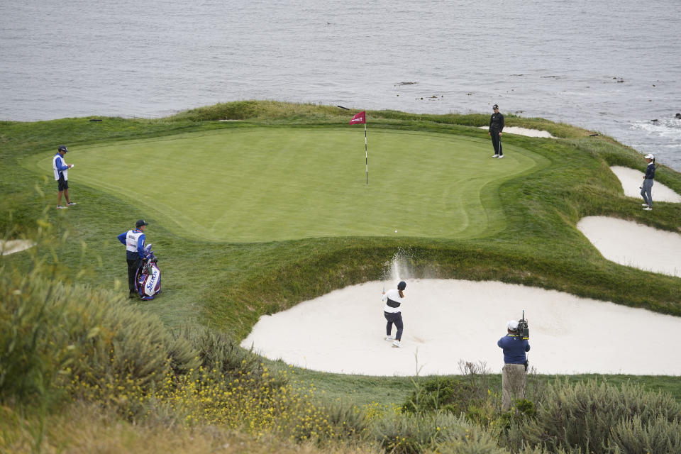 Nasa Hataoka, of Japan, hits from the bunker to the seventh green during the second round of the U.S. Women's Open golf tournament at the Pebble Beach Golf Links, Friday, July 7, 2023, in Pebble Beach, Calif. (AP Photo/Darron Cummings)