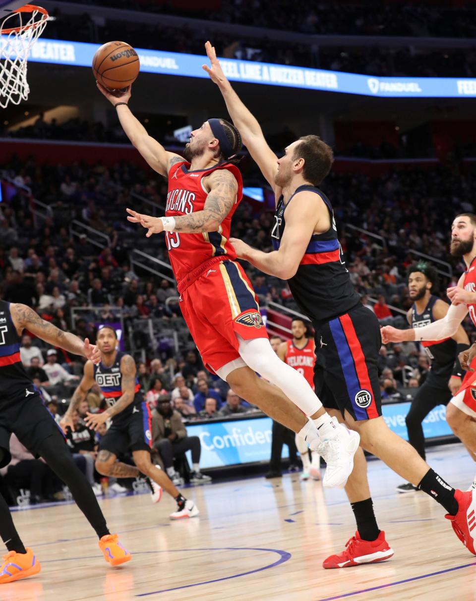 Detroit Pistons forward Bojan Bogdanovic (44) defends against New Orleans Pelicans guard Jose Alvarado (15) during second period action Friday, January 13, 2023.