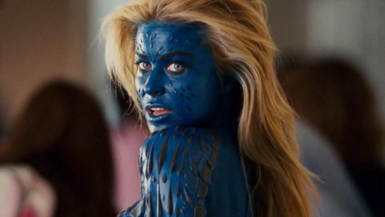  Carmen Electra poses in her Mystique makeup in a Mutant Academy hallway in Epic Movie. 