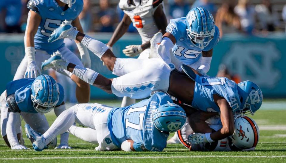 North Carolina’s Tyler Thompson (40) stops Campbells’ Chris McKay Jr. (11) for a one-yard loss in the fourth quarter on Saturday, November 4. 2023 at Kenan Stadium in Chapel Hill, N.C.