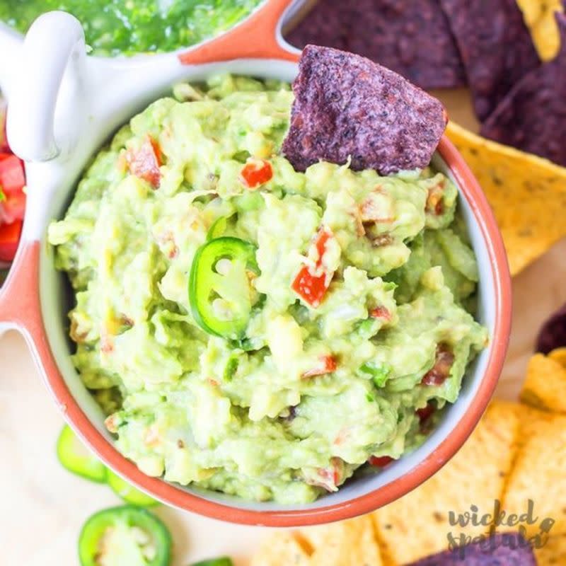 <p>Wicked Spatula</p><p>Flavorful guacamole that's super easy to make and made with healthy ingredients. </p><p><strong>Get the recipe:</strong><strong> <a href="https://www.wickedspatula.com/classic-guacamole/" rel="nofollow noopener" target="_blank" data-ylk="slk:Simple Easy Guacamole;elm:context_link;itc:0;sec:content-canvas" class="link ">Simple Easy Guacamole</a></strong></p>