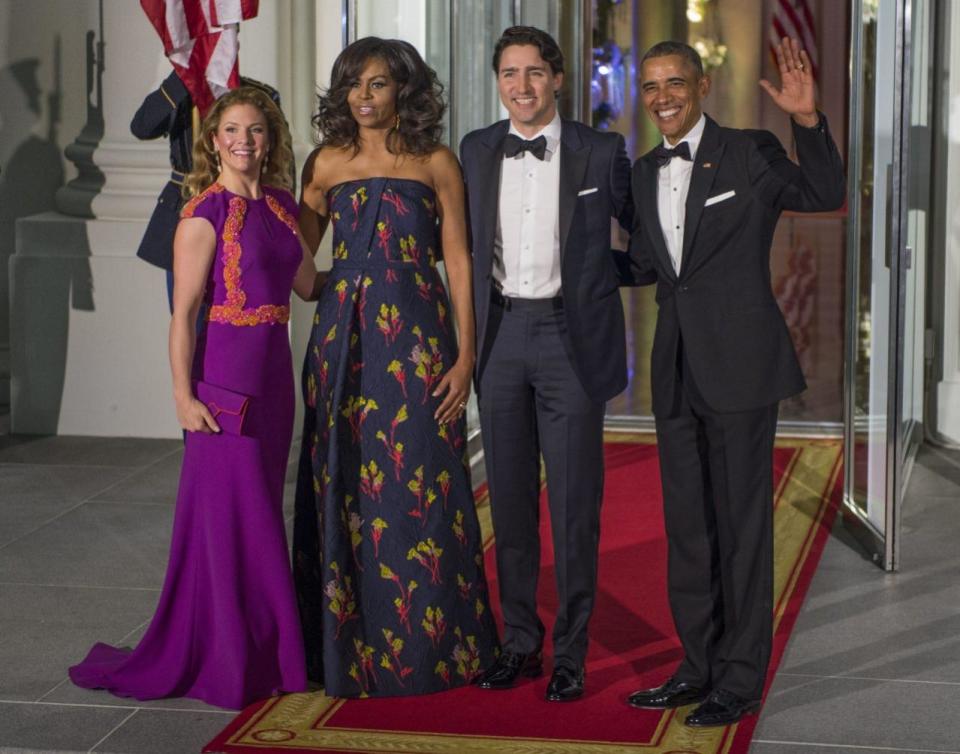<p>What do you wear to rub elbows with Hollywood’s finest? If you’re Sophie Grégoire-Trudeau, the answer is a breathtaking magenta gown with orange detailing by Canadian designer, Lucian Matis. First Lady Michelle Obama stunned in a strapless Jason Wu gown, while the men looked dapper in bow ties. <i>(Photo: Shawn Thew/EPA)</i><br></p>