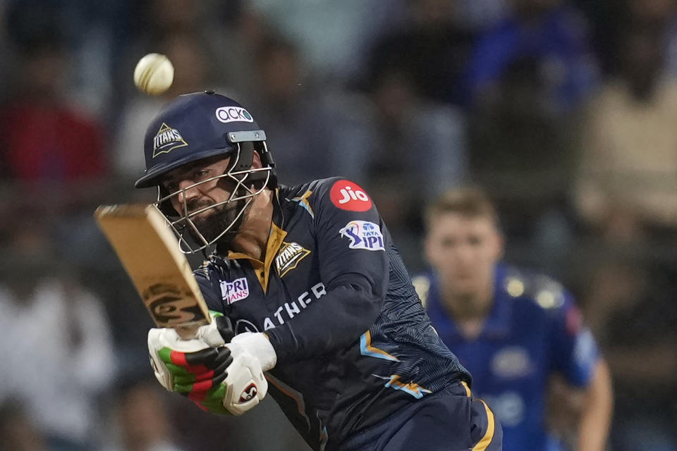 Gujrat Titans' Rashid Khan plays a shot during the Indian Premier League cricket match between Mumbai Indians and Gujrat Titans in Mumbai, India, Friday, May 12, 2023. (AP Photo /Rajanish Kakade)