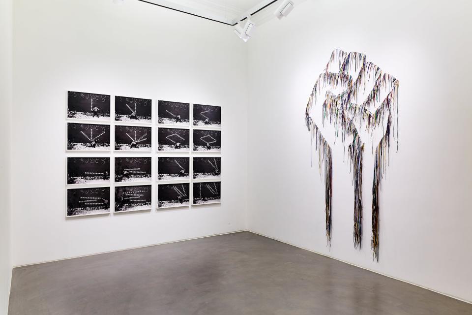 Installation view, Robin Rhode and Nari Ward, Power Wall.