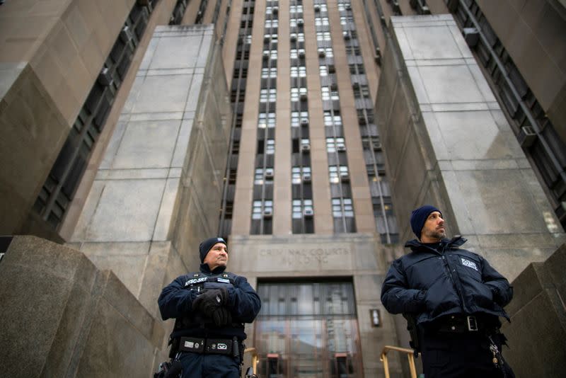 NYPD officers stand guard in front of New York Criminal Court while film producer Harvey Weinstein is having his sexual assault trial in the Manhattan borough of New York City